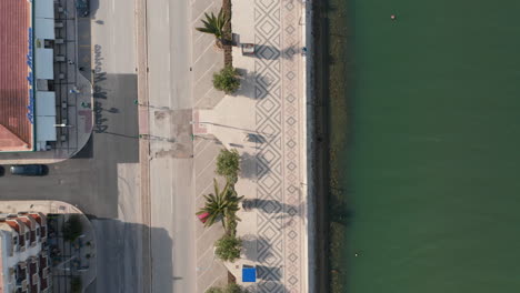 Amazing-top-down-aerial-drone-view-of-Lagos-seafront-town,-Portugal,-forward,-day