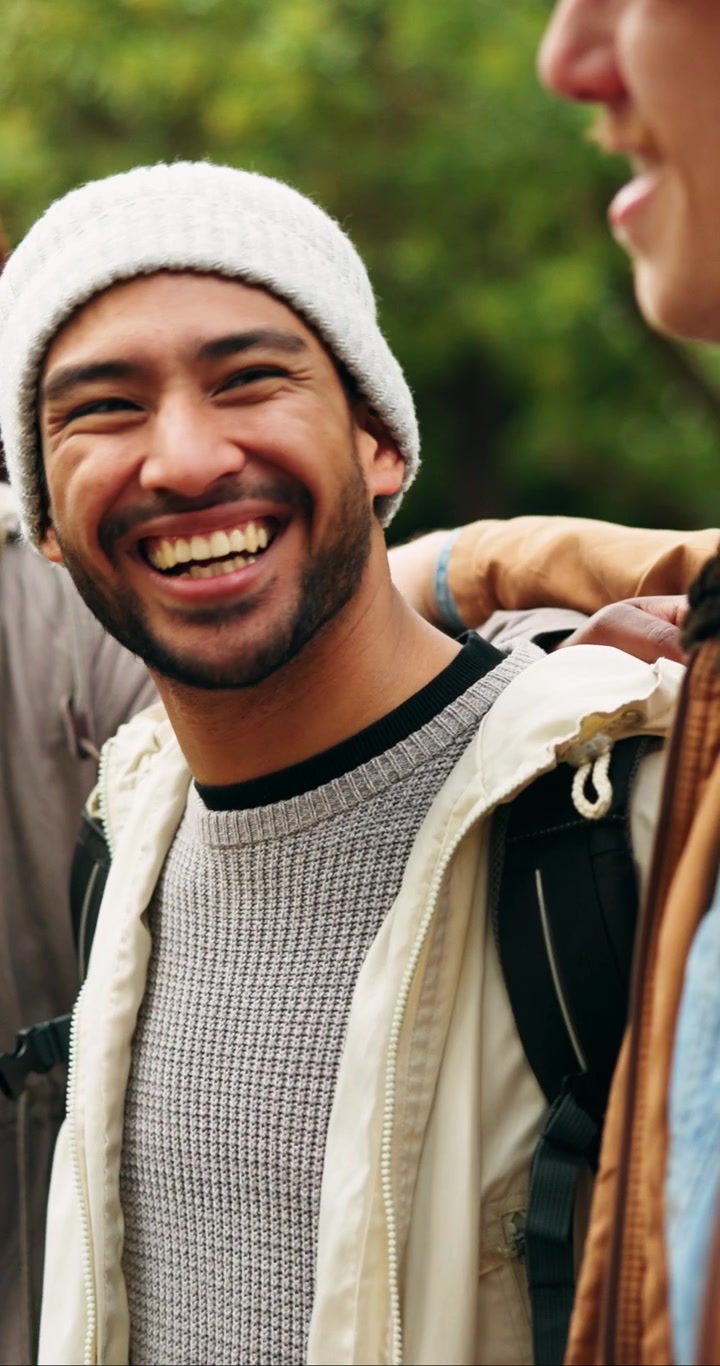 Young Man Laughing With Friends Outdoors