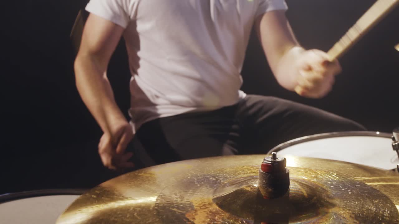 Man plays drums on stage 4K
