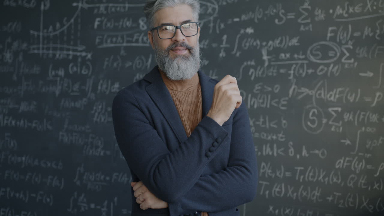 Professor in front of a chalkboard full of equations