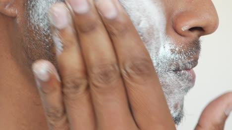 applying shaving cream to face
