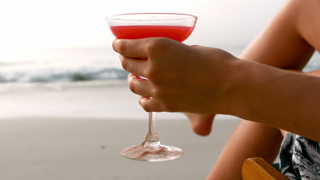 woman holding cocktail