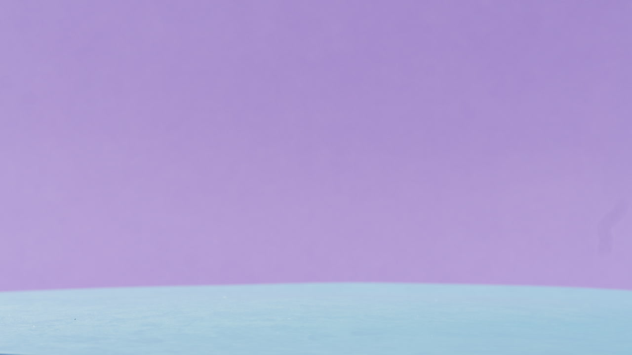 Assorted Gummy Bears on a Light Blue Surface