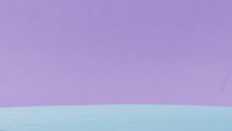 assorted gummy bears on a light blue surface