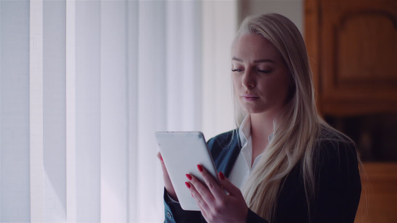 Businesswoman Using Digital Tablet At Home Office Browsing Internet Reading Emails 1