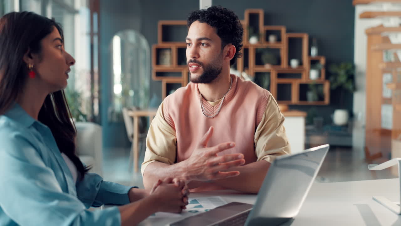 Two Business Colleagues Discussing Project Ideas in a Modern Office