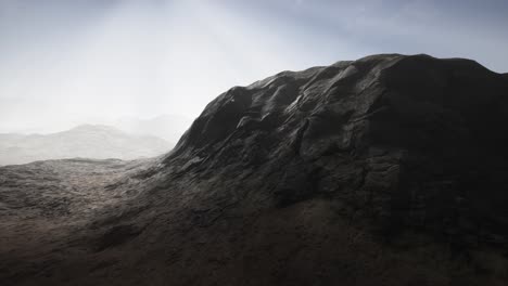 sun rays over mountains in a valley