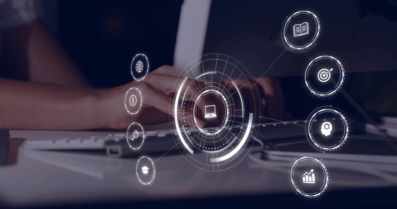 Mid adult woman's hands initiating typing on keyboard displaying circular holographic technology UI