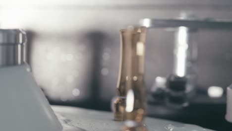 conveyor rotating serum tubes in modern pharmaceutical manufacturing factory