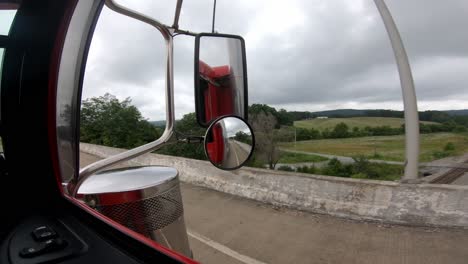 Cutaway-shot-out-semi-truck-window-along-the-highway