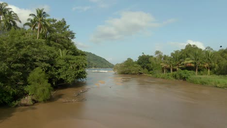 flying over tuito river in yelapa, jalisco, mexico - aerial drone shot