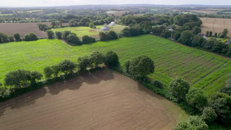 brittany rural landscape in france, aerial drone forward view