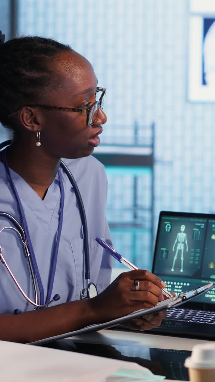 Vertical Video Female nurse and patients reviewing diagnostic results in a medical office