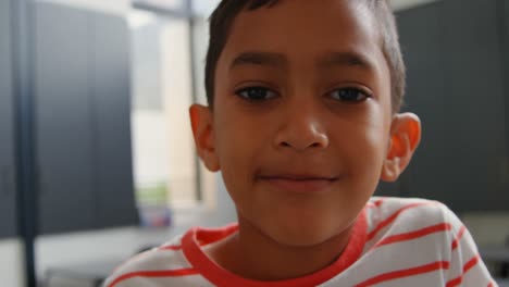 close-up of asian schoolboy standing in classroom at school 4k