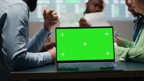 corporate staff participate in late advisory board session with mockup
