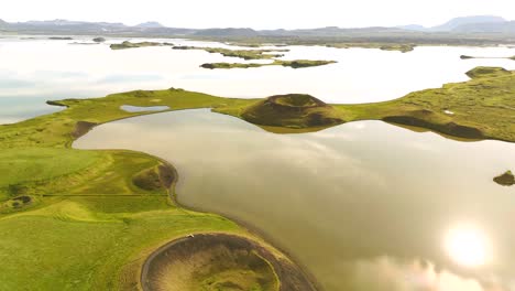 discover the stunning contrasts of green and black at skútustaðagígar, as the drone captures the intricate details of this unique geological wonder.
