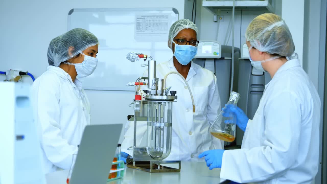 Team of scientists interacting with each other 4k