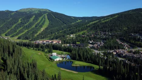 alpine ski resort town sun peaks in british columbia, canada. aerial drone shot