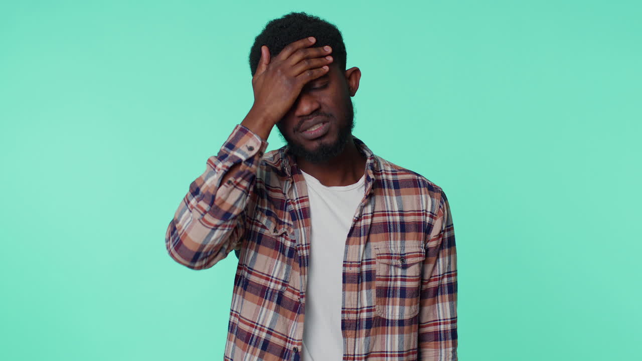 Man rubbing temples to cure headache problem, suffering from tension and migaine, stress, pain