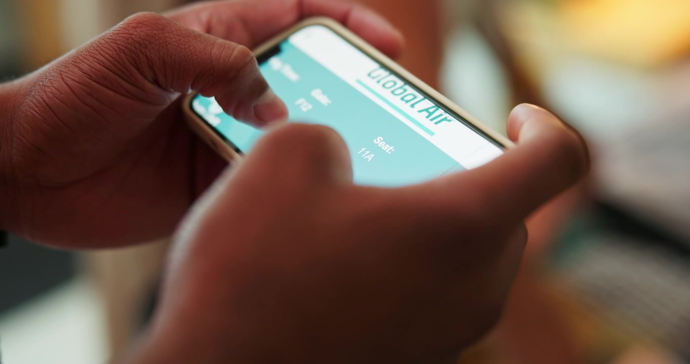 Person Checking Airline Boarding Pass on Smartphone