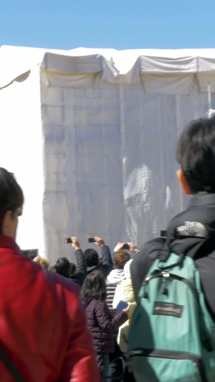 Crowd of People Near a Covered Building