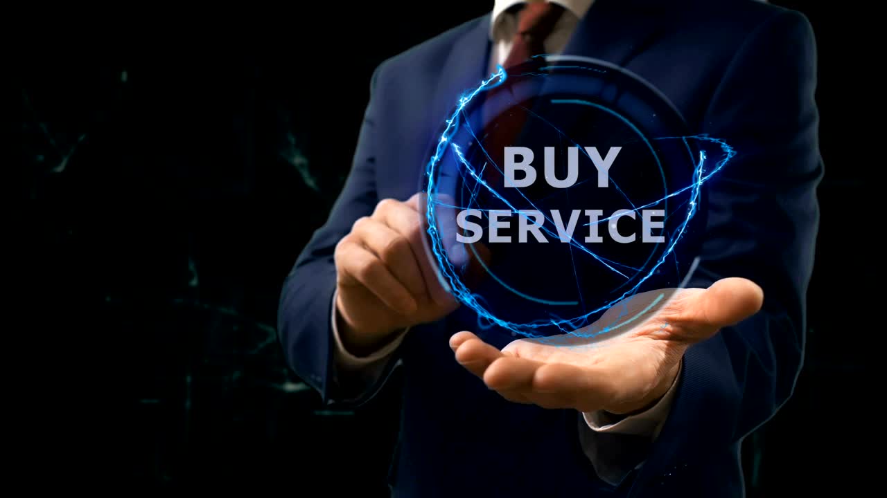 Businessman shows concept hologram Buy service on his hand