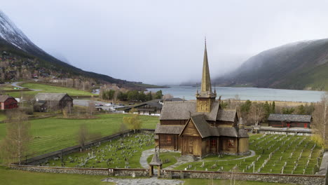 panoramic view of lom stave church and graveyard in innlandet county, oppland, norway