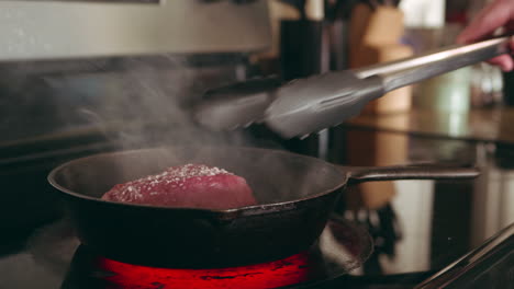 searing a perfect steak in a cast iron skillet