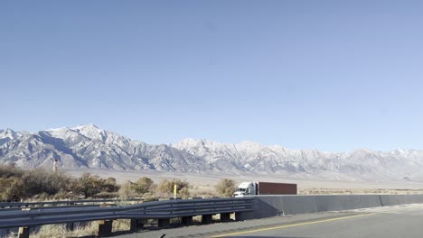 driving on the east side of the sierra nevada mountains, desert landscape