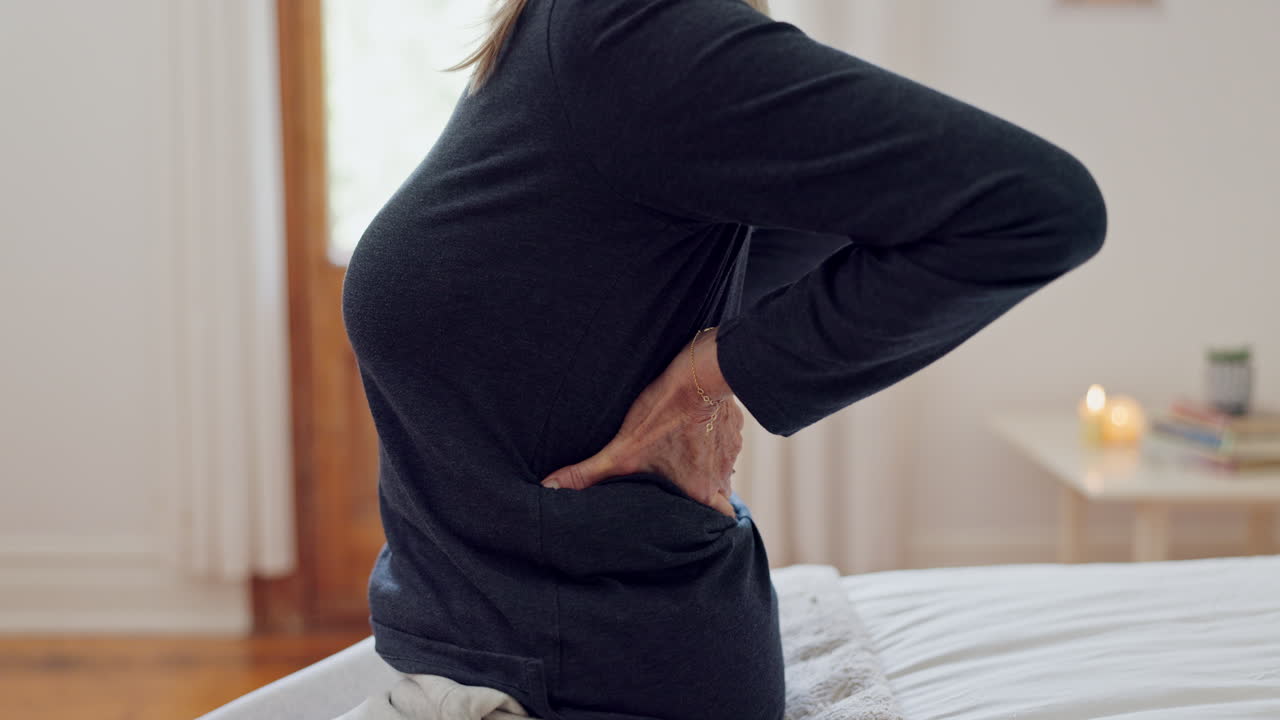 Senior woman, hands and back pain in home