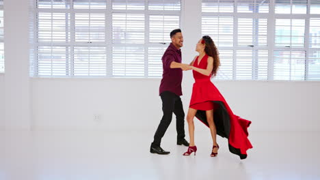 Happy,-salsa-and-couple-in-dancing-studio-training