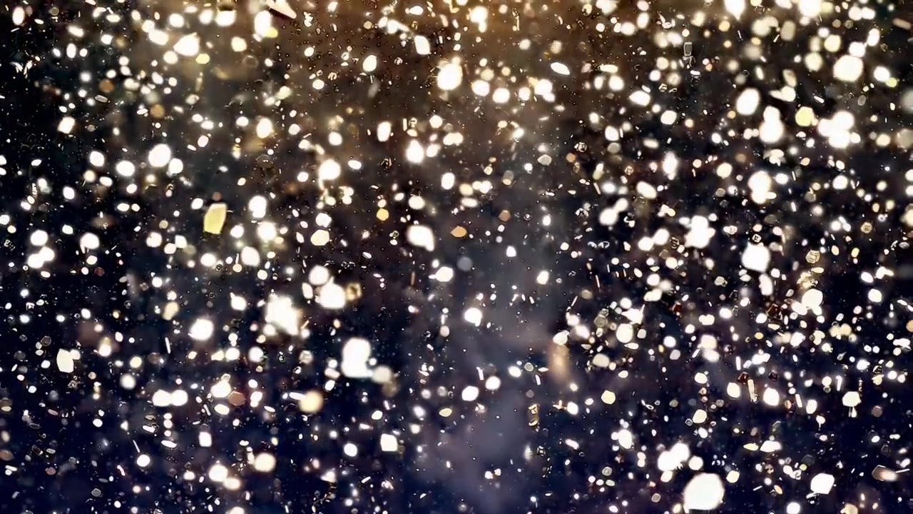 Golden Glitter Particles Falling and Shimmering on a Dark Background
