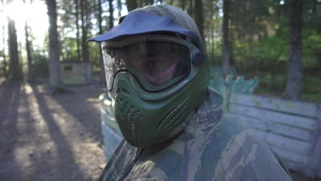 Portrait-young-man-in-paintball-mask-on-head-for-protective-in-shooting-game
