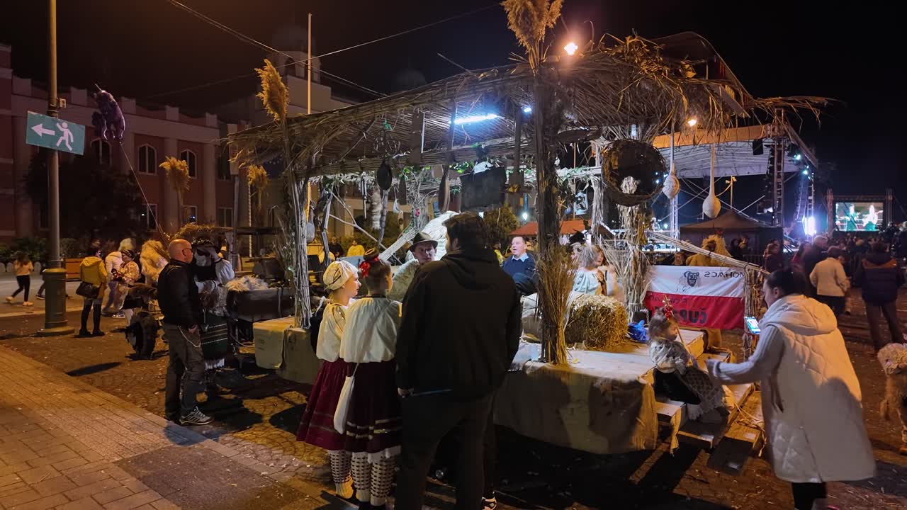 Nighttime Street Festival with Traditional Costumes and Performances