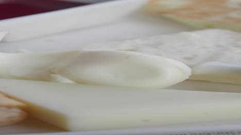 assorted cheeses on a plate