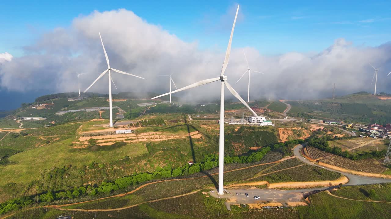 Wind power turbines on high hills in Vietnam at sunrise - Wind power