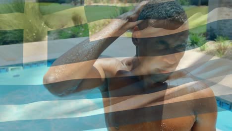Animation-of-waving-greece-over-happy-african-american-man-in-pool
