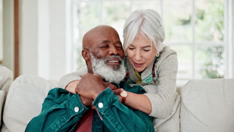 senior couple, talking and hug on sofa with love