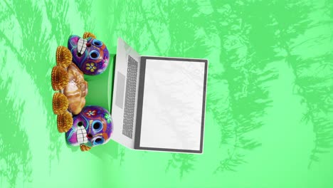 Day-of-The-Dead-Festival,-Dia-de-Muertos-,-Design-Mockup,-Mexico,Laptop,-Skulls,-Traditional-Floral-and-Pastry,-Green-Background,-Vertical