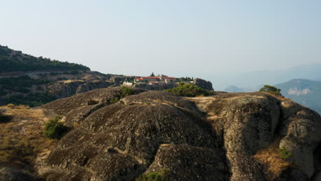 aerial view of a monastery on a rocky mountain