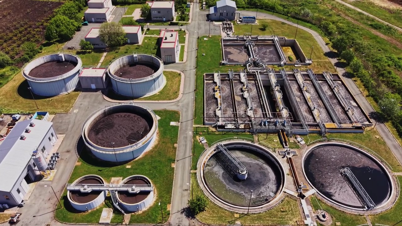 Water treatment facility shows large tanks and layout from above