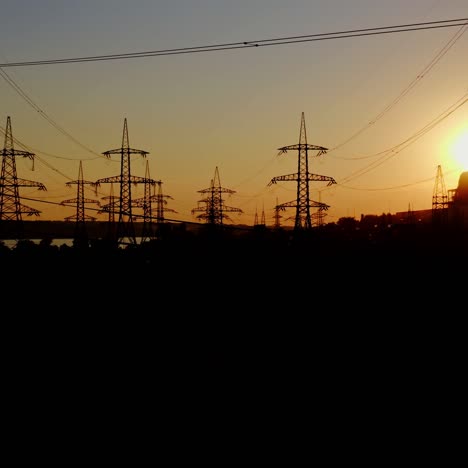 high voltage post at sunset