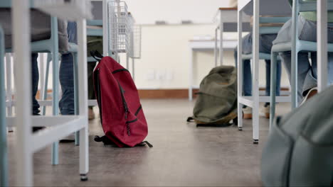 classroom with students and backpacks