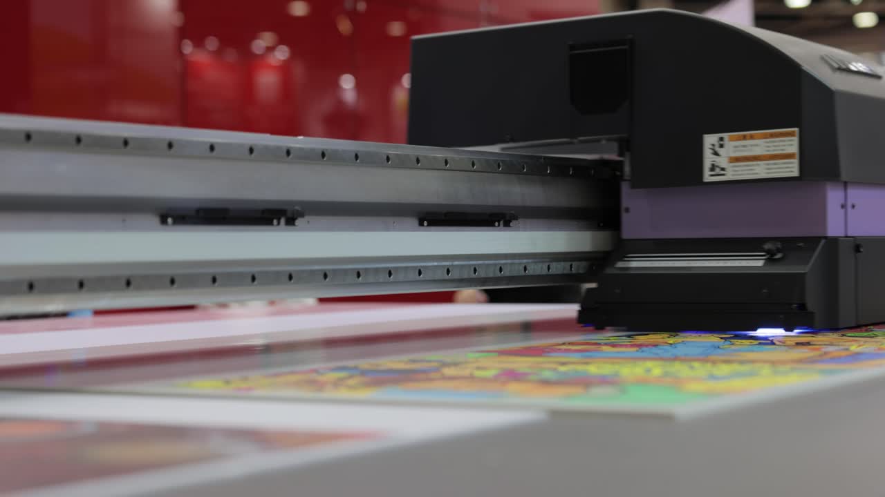 Modern Digital Large format UV printer. Printing production technologies. UV pinning is the process of applying a dose of low intensity ultraviolet light to a UV curable ink
