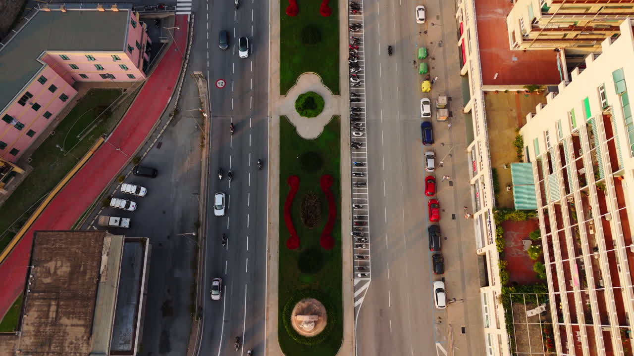 Genoa, Italy drone moves from city traffic around landmark Wind Rose Roundabout to stunning cityscape view