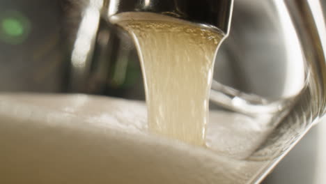 pouring beer into a glass