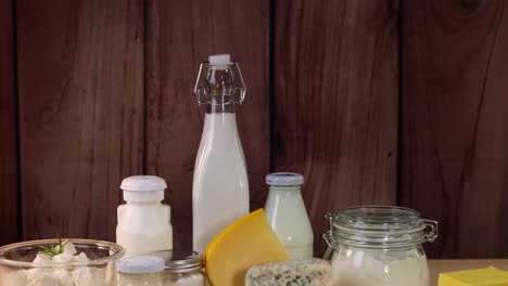 various dairy items displayed against wooden background