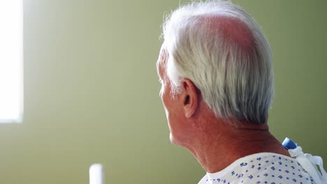 Senior-patient-sitting-in-a-thoughtful-mood