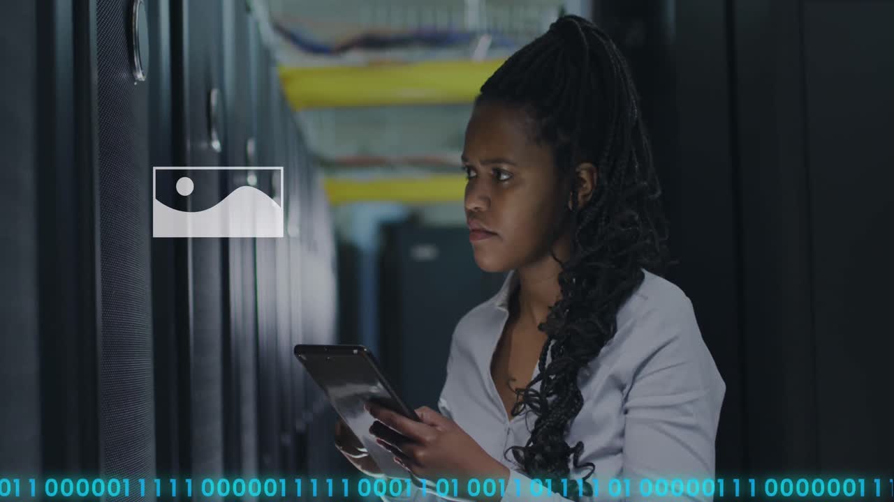 Animation of binary coding and female african american it engineer and computer servers