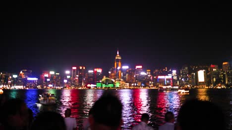 colorful skyline reflections on water at night